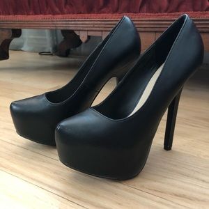 Black platform pumps